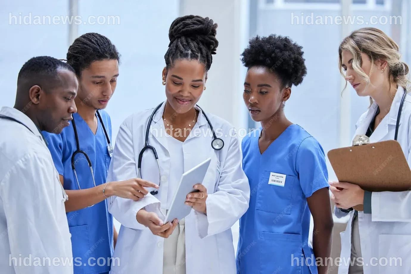 Premium Photo | Diversity healthcare and staff with tablet talking and ...